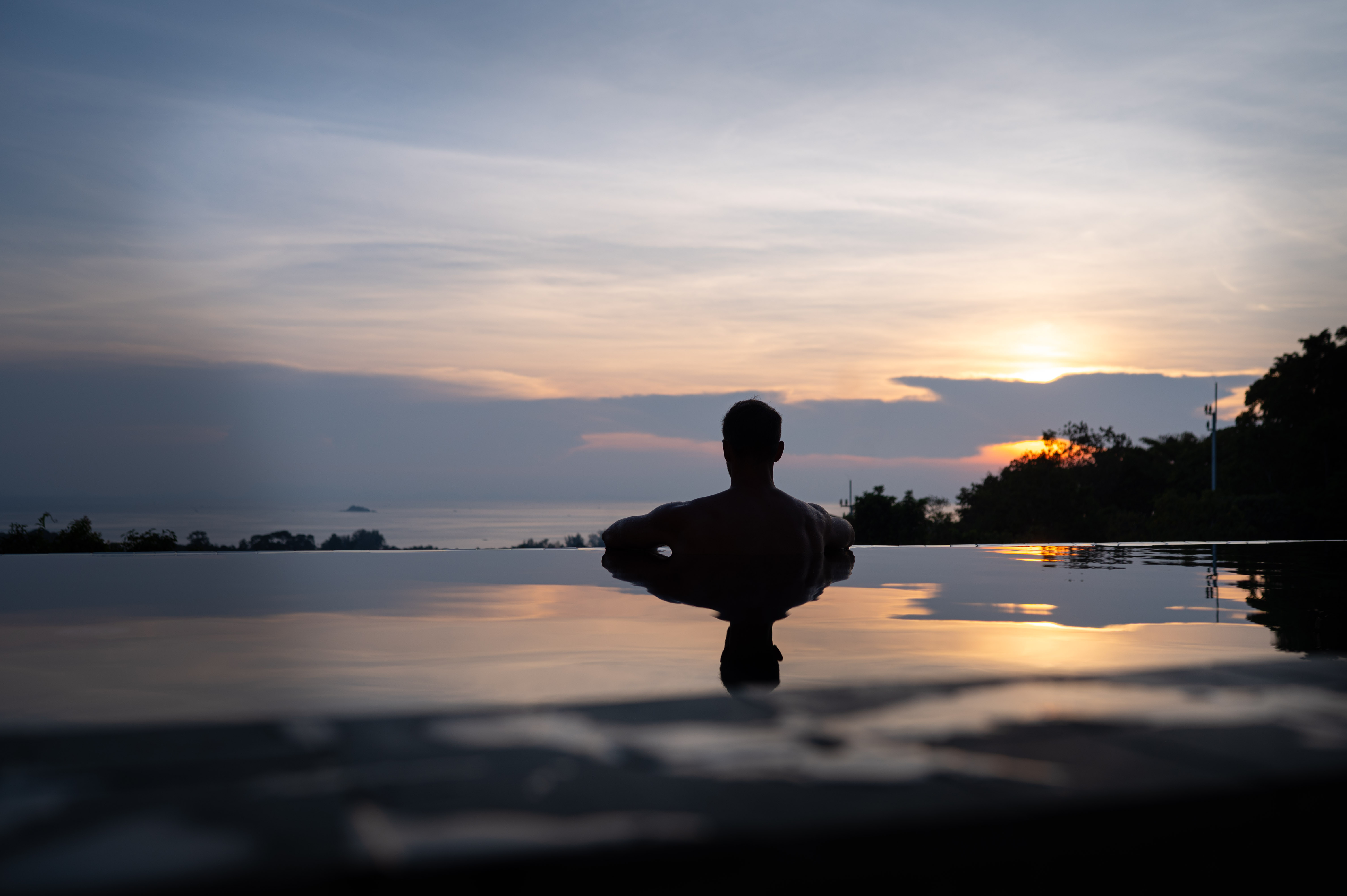 Siam Mila Villa — dramatic sunset infinity pool silhouette